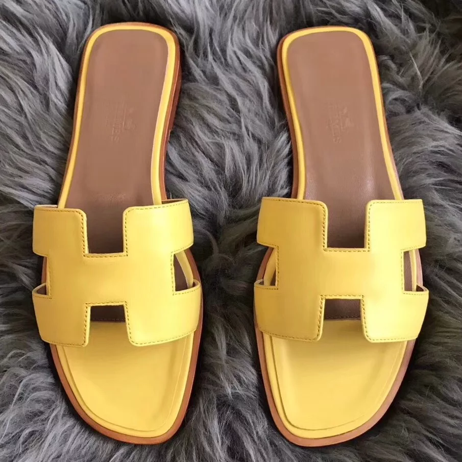 HERMES ORAN SLIDE SANDALS IN YELLOW SWIFT CALFSKIN - HMSD128