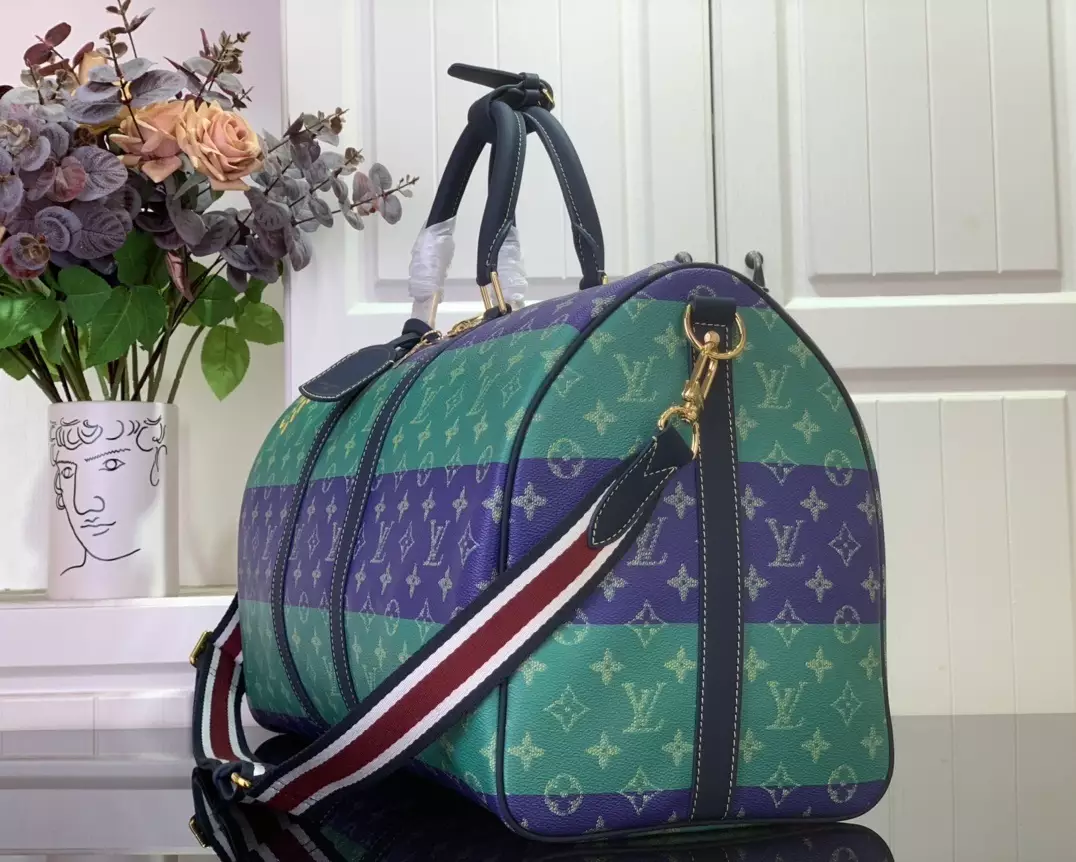 KEEPALL BANDOULIÈRE 50 LOUIS VUITTON HERITAGE - LW454 DISCOVERY BACKPACK PM SKY BLUE MONOGRAM CANVAS